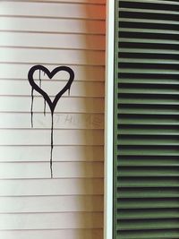 Close-up of heart shape on wall