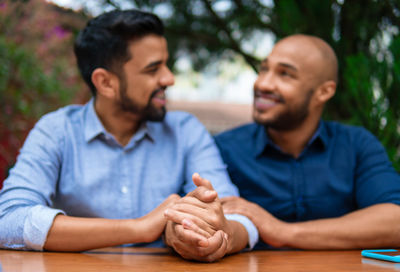 Portrait of senior couple sitting at park