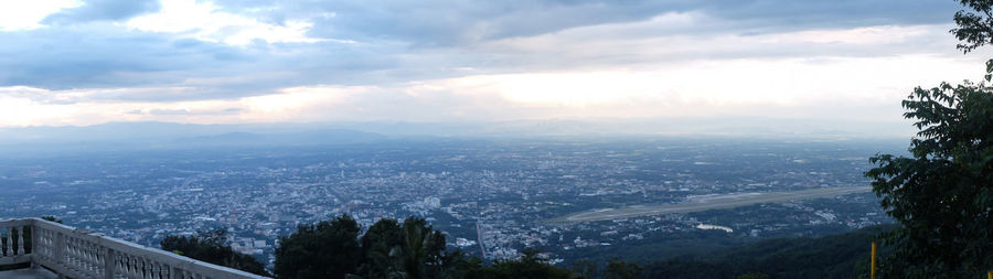 Aerial view of city and buildings against sky