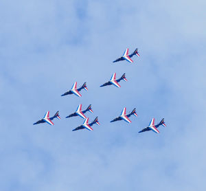 Patrouille de france air military show meeting - aircraft flying in a clouded blue sky