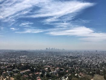 Aerial view of cityscape against sky