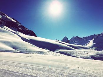 Scenic view of snow covered mountains
