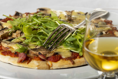 Close-up of pizza in plate on table