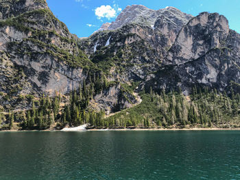 Scenic view of sea and mountains against sky