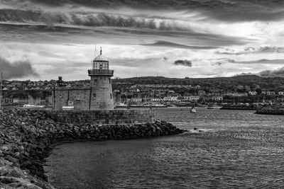 View of lighthouse against cloudy sky