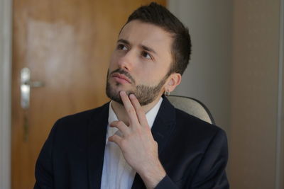 Portrait of young man looking away