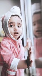 Portrait of cute baby girl looking away
