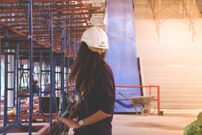 Rear view of woman working