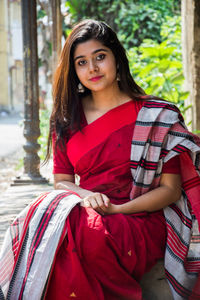 Portrait of young woman wearing sari