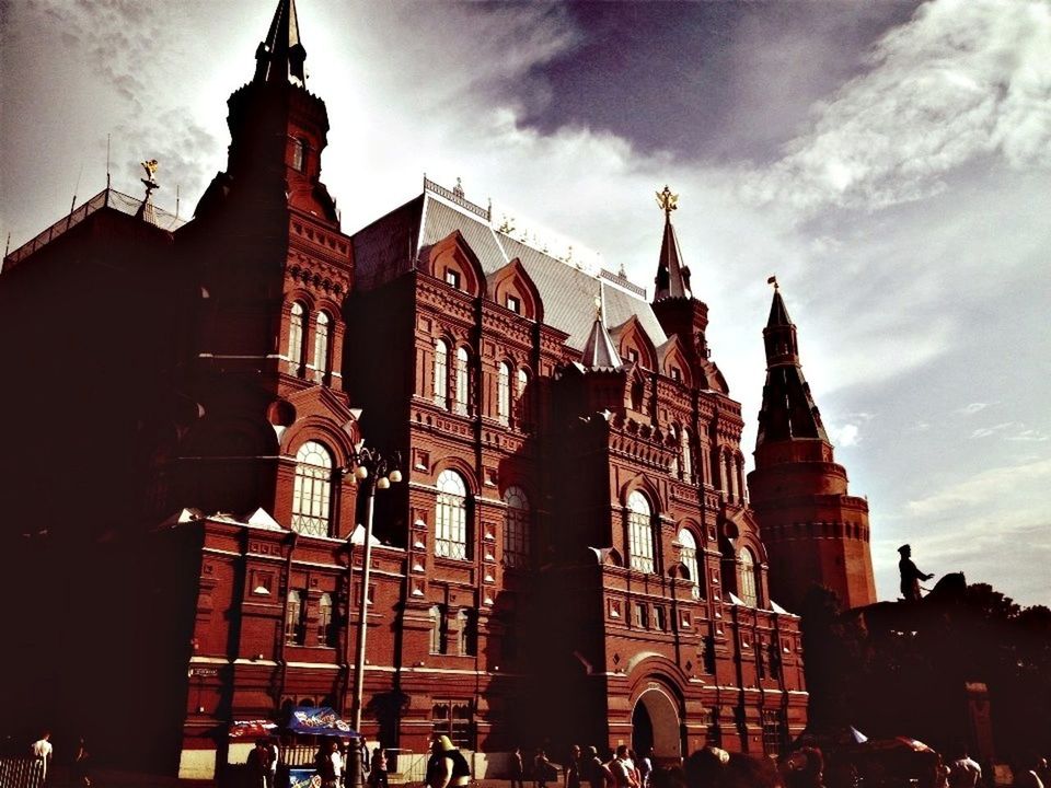 architecture, building exterior, built structure, sky, place of worship, religion, low angle view, spirituality, church, city, history, travel destinations, famous place, cloud - sky, facade, cathedral, dusk, old town