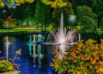 Scenic view of waterfall and trees