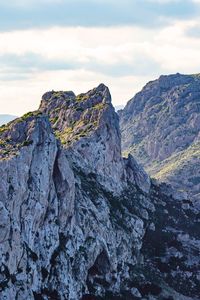 Rock formations on mountain against sky