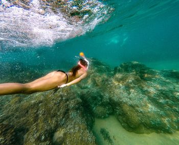 Woman swimming in sea