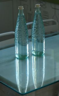 Close-up of glass bottle on table