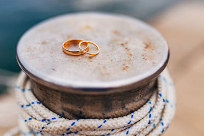 Close-up of wedding rings on table
