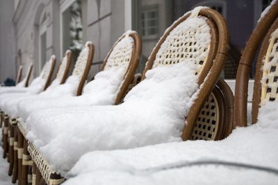 Close-up of snow covered basket on field