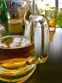 Close-up of beer glass on table