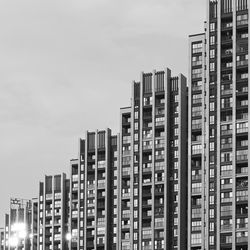 Low angle view of buildings against sky in city