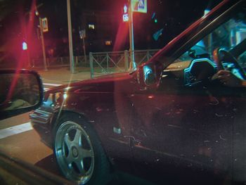 Cars on wet street at night