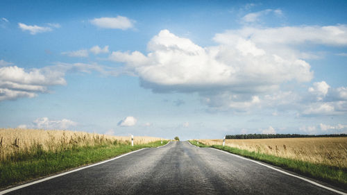 Road amidst landscape against sky