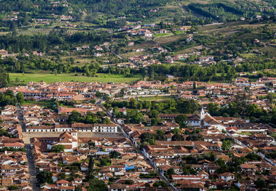 High angle view of townscape and trees in city