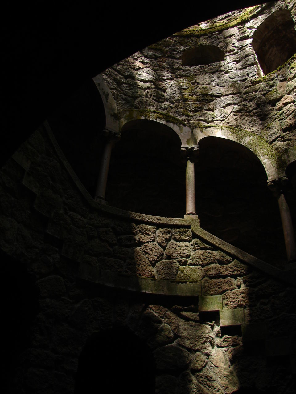 architecture, built structure, the past, history, arch, indoors, building, old, no people, low angle view, ancient, night, wall, dark, stone wall, solid, nature, travel destinations, old ruin, architectural column, ancient civilization, ruined