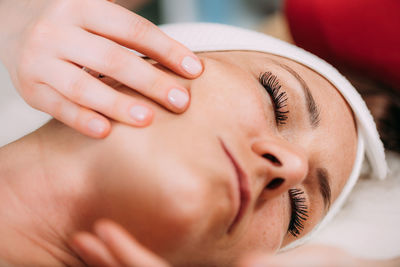 Face lifting massage, beautiful woman getting face lifting massage in a beauty salon.