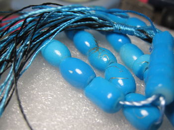 Close-up of blue paint on table