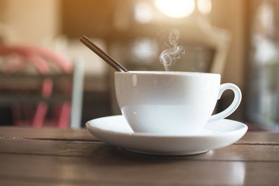 Close-up of coffee cup on table