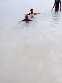 Portrait of men swimming in sea