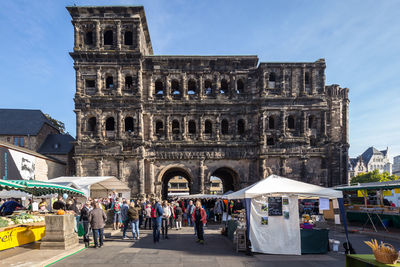 Group of people in front of historical building