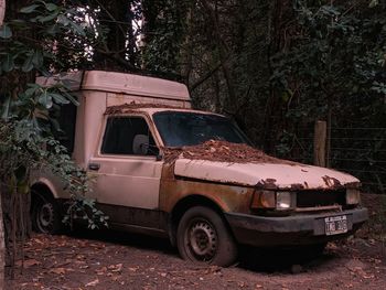 Old abandoned car on land