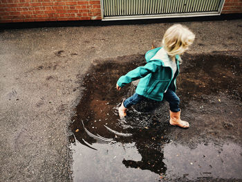 High angle view of girl playing in water