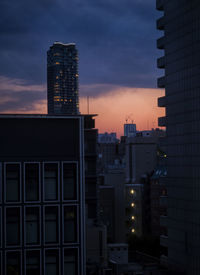 Buildings against sky during sunset