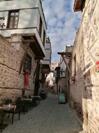 Narrow street amidst buildings in town