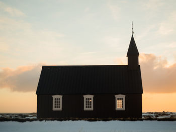 Building against sky during sunset