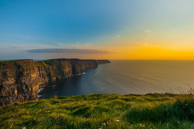 Scenic view of sea against sky during sunset