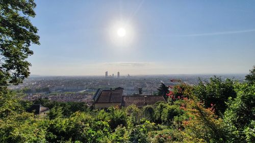 Panoramic view of trees and buildings against sky