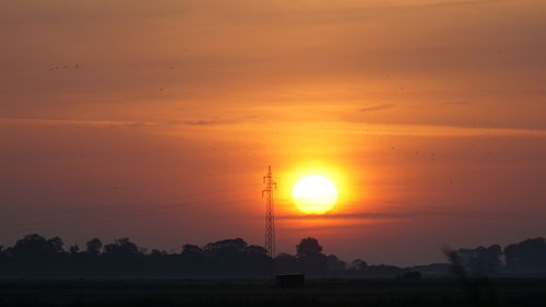 Scenic view of silhouette landscape against romantic sky at sunset