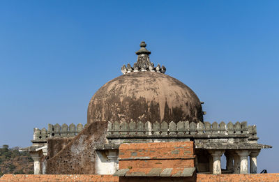 Low angle view of historic building against clear blue sky