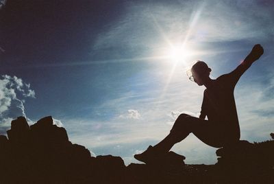 Low angle view of silhouette man against sky during sunset