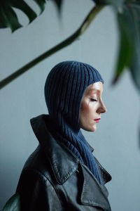 Close-up portrait of young woman looking away