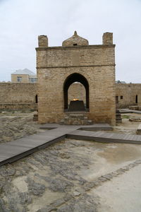 Entrance of historic building against sky