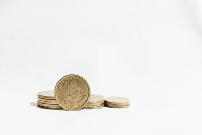 Close-up of coins on white background