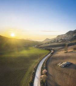 Scenic view of landscape against sky during sunset