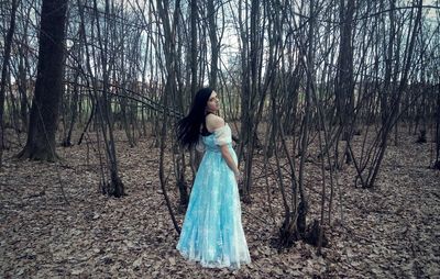 Portrait of young woman in forest