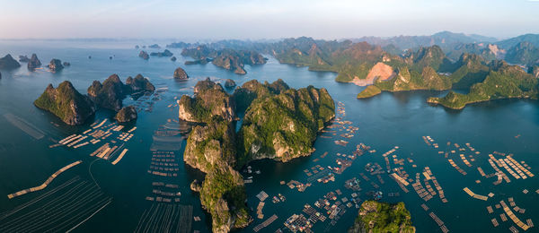 High angle view of sea and mountains against sky