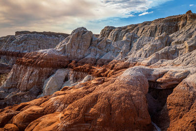 Rock formation on land against sky