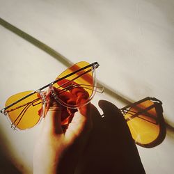 Close-up of hand holding eyeglasses