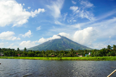 Scenic view of lake and mountains against sky